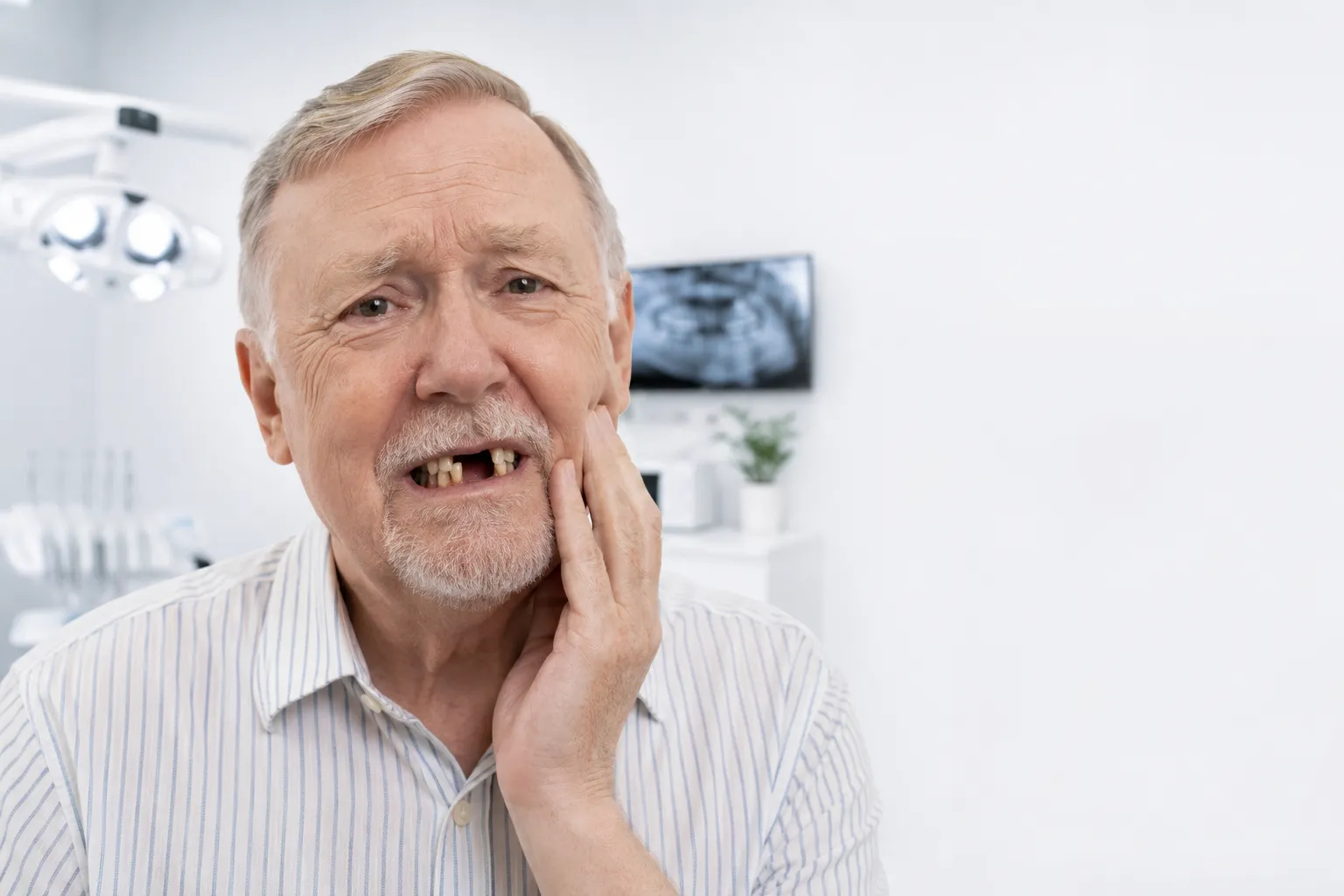 Older man concerned about missing or failing teeth